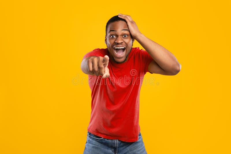 excited-african-guy-pointing-finger-camera-laughing-yellow-background-i-choose-you-excited-afr...jpg