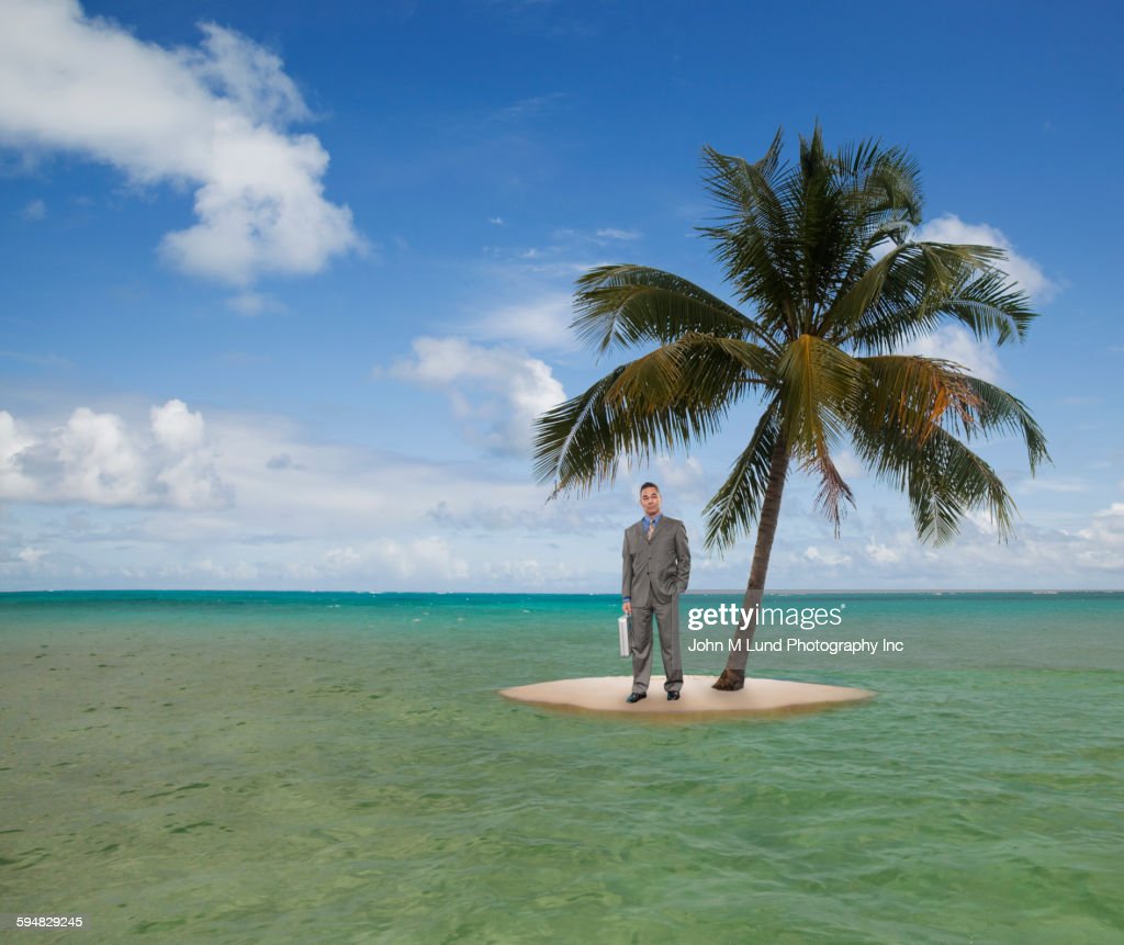 mixed-race-businessman-stranded-on-tropical-island-picture-id594829245-577474725.jpg
