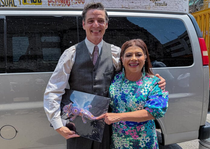 Mexico City Mayor Clara Brugada and actor Pedro Pascal pose with an axolotl figurine
